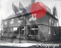 The original building and laboratory of the London School of Tropical Medicine at the Royal Albert Dock, with Sir James Michelli, the Secretary of the Seamen's Hospital Society and Dr D C Rees (seated) the first Director of the School
