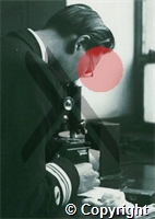 Dr IT The looking down a microscope
