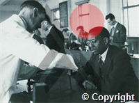 Students working in laboratory, Dr FR Roberts, Gold Coast (now Ghana) in foreground